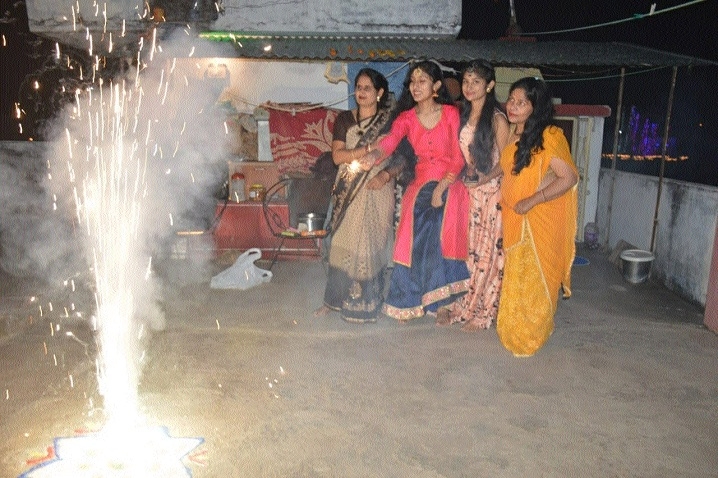  family enjoying firework