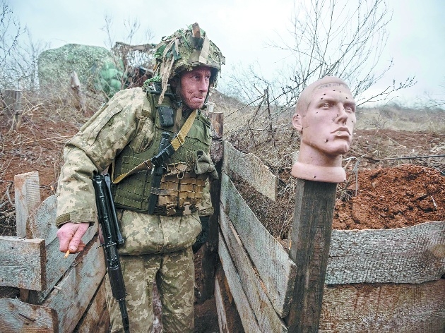 A Ukrainian soldier walks