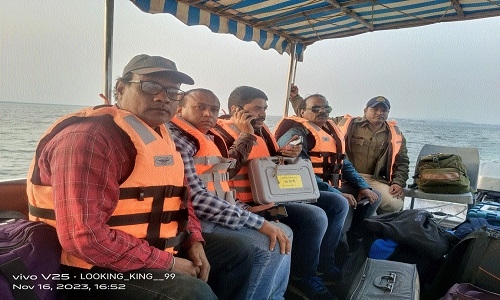 Polling team leaves  by motorboat