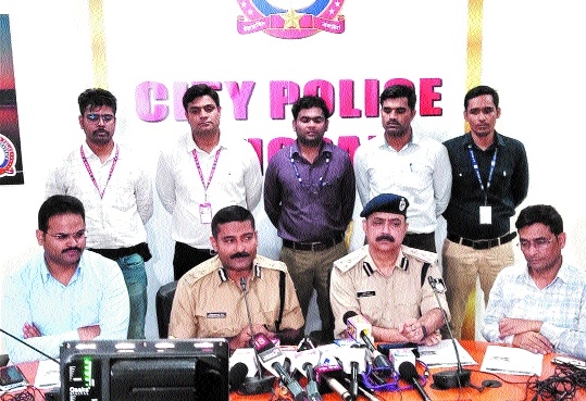 Two men held for fraudulently withdrawing money from ATMs
