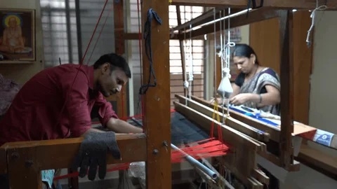 women making saree in saree machine