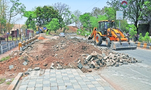 Demolition work on bridge at Ambazari Lake