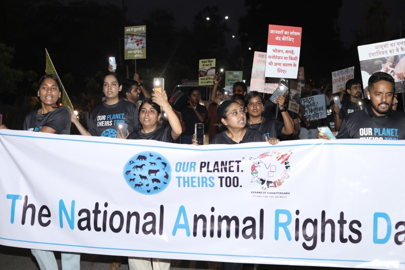 Animal rights activists holding placards to invoke compassion for ...