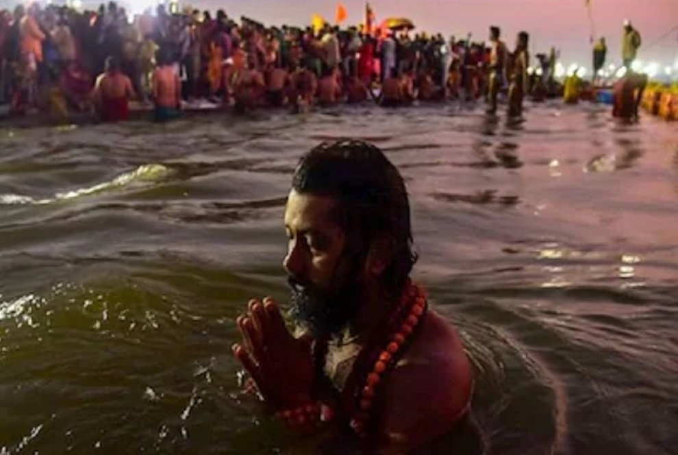 Devotees at Maha Kumbh brave