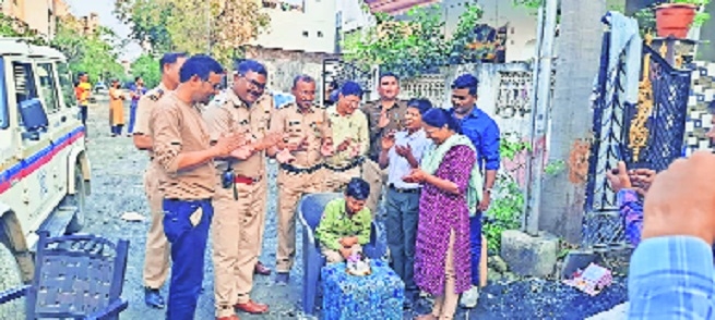 Sanchit Narad cutting the cake after reuniting with family 
