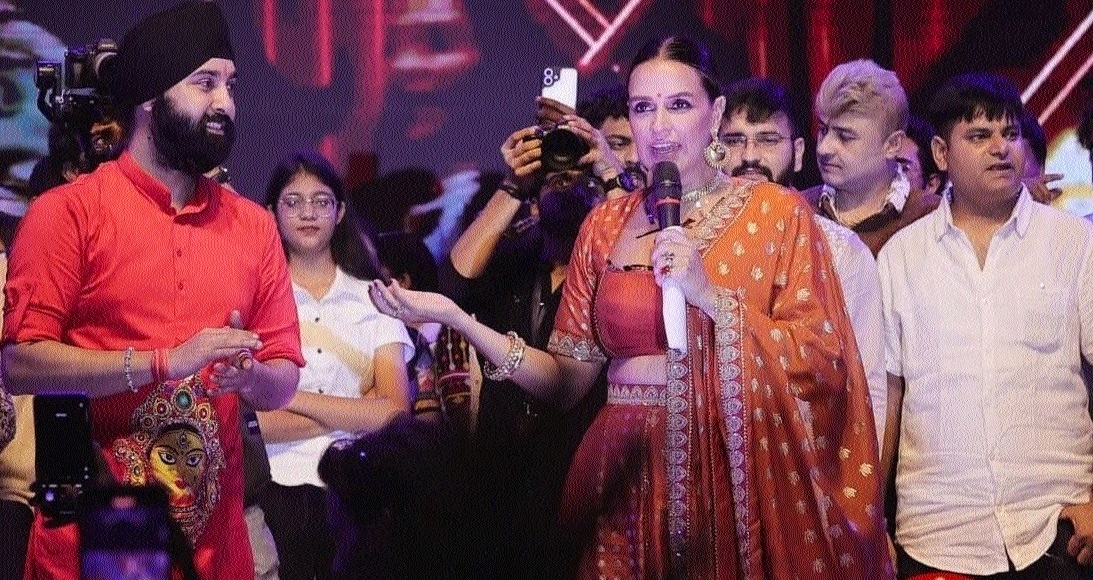 Bollywood actress Neha Dhupia addressing the crowd
