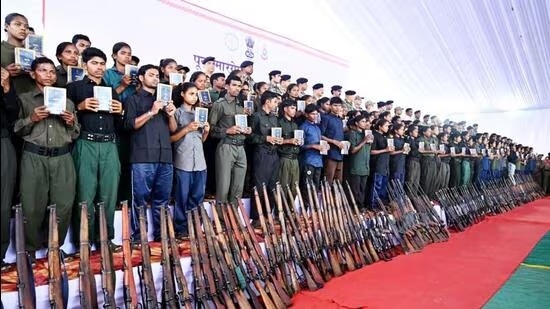 Naxalites hold copies of the Constitution of India after 