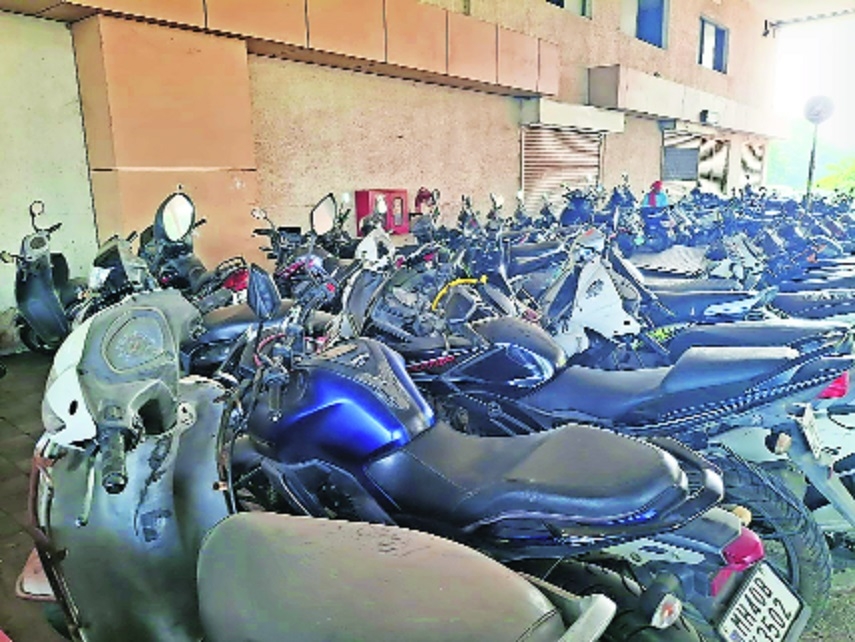 A maze of two-wheelers chokes the Zero Mile metro station parking area as commuters 
