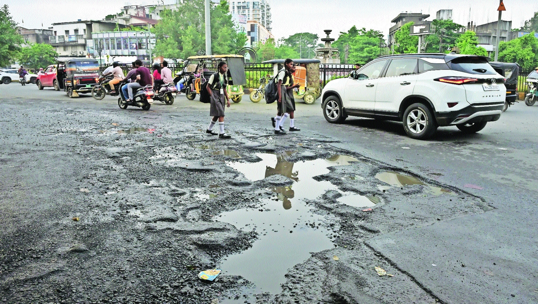 Broken surfaces crater-like potholes and loose gravel make 