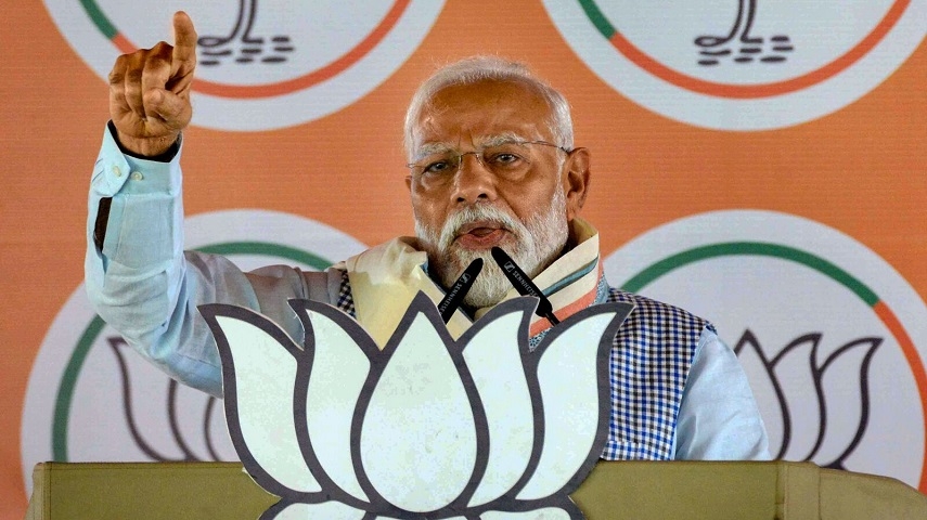 Prime Minister Narendra Modi waves to the gathering during