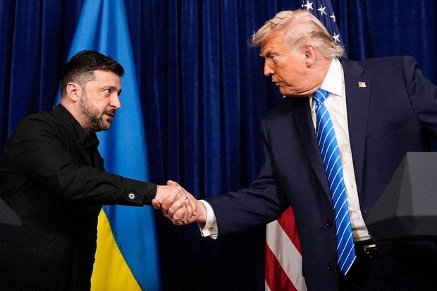 President Donald Trump and Ukraines President Volodymyr Zelenskyy shake hands 