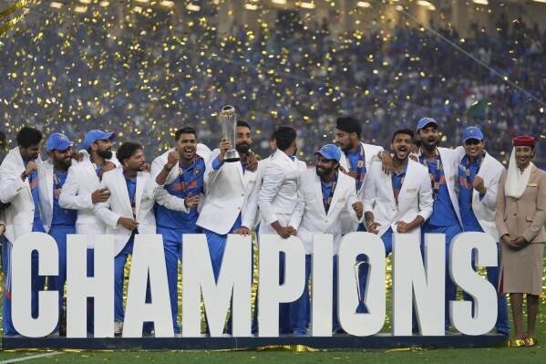 Indian players celebrate with the trophy 