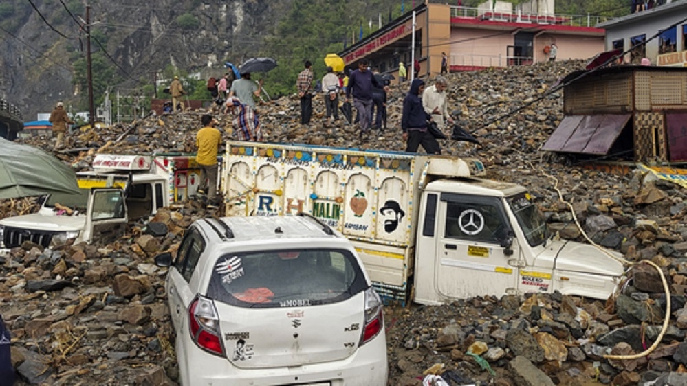 Vehicles stuck in the debris after a rain-triggered landslide
