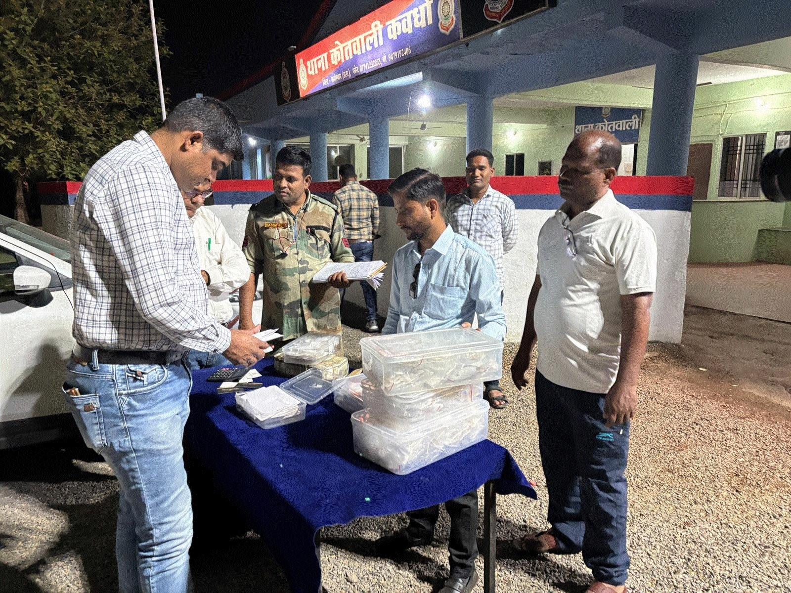 Police observing the seized booty