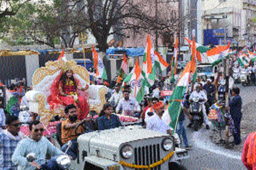 A girl attired as Bharat Mata
