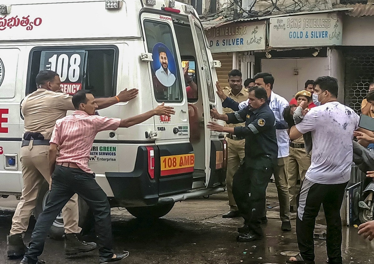 An injured is carried to an ambulance