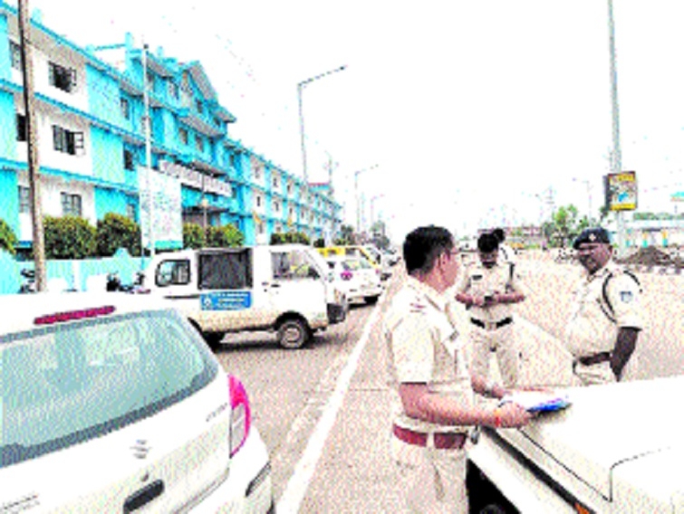 Traffic Police and Transport Department officials conducting a crackdown outside 