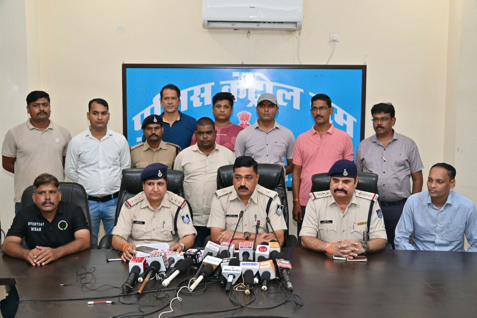 ASP Suryakant Sharma accompanied by police team addressing