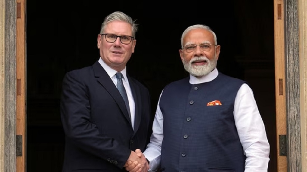 Britains Prime Minister Keir Starmer welcomes Indian Prime Minister Narendra Modi