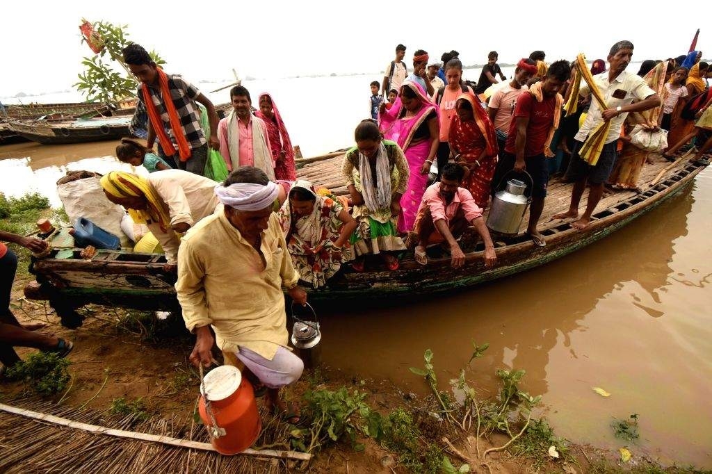 People move to a safer area on a boat 