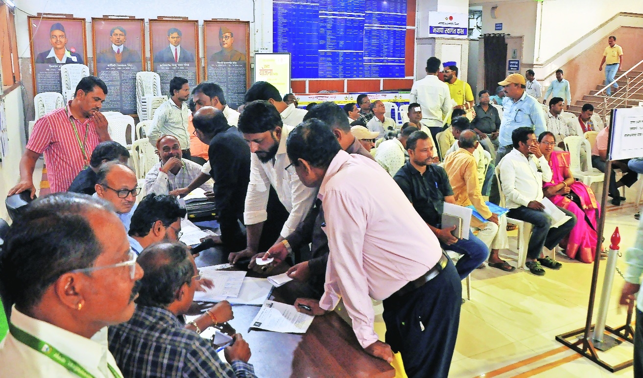 NMC officials dealing with citizens at the hearing on objections