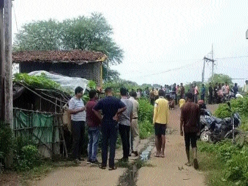 Police and villagers gathered at the incident site