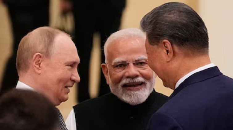 PM Narendra Modi talks with Russian President Vladimir Putin