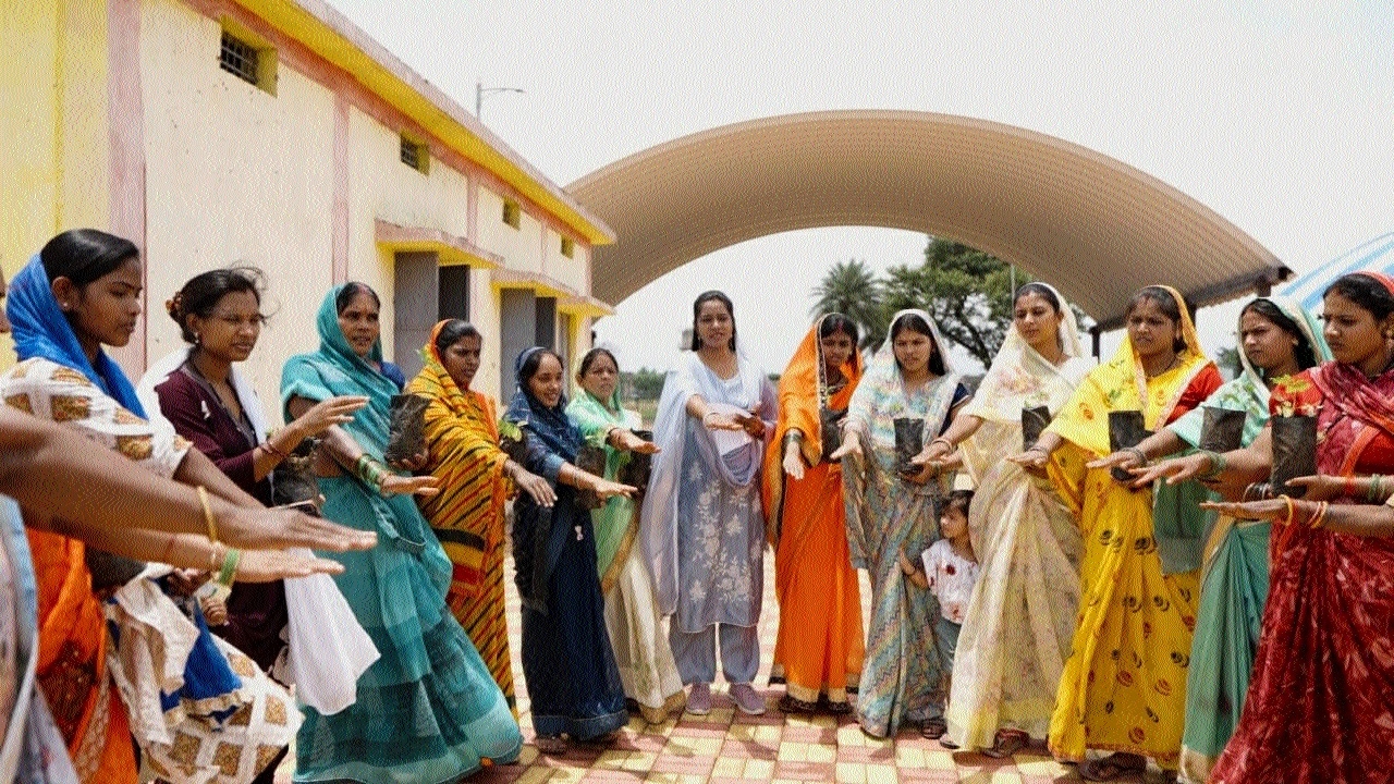 Women in village Rakhi taking oath rid the village of social evils and regressive traditions
