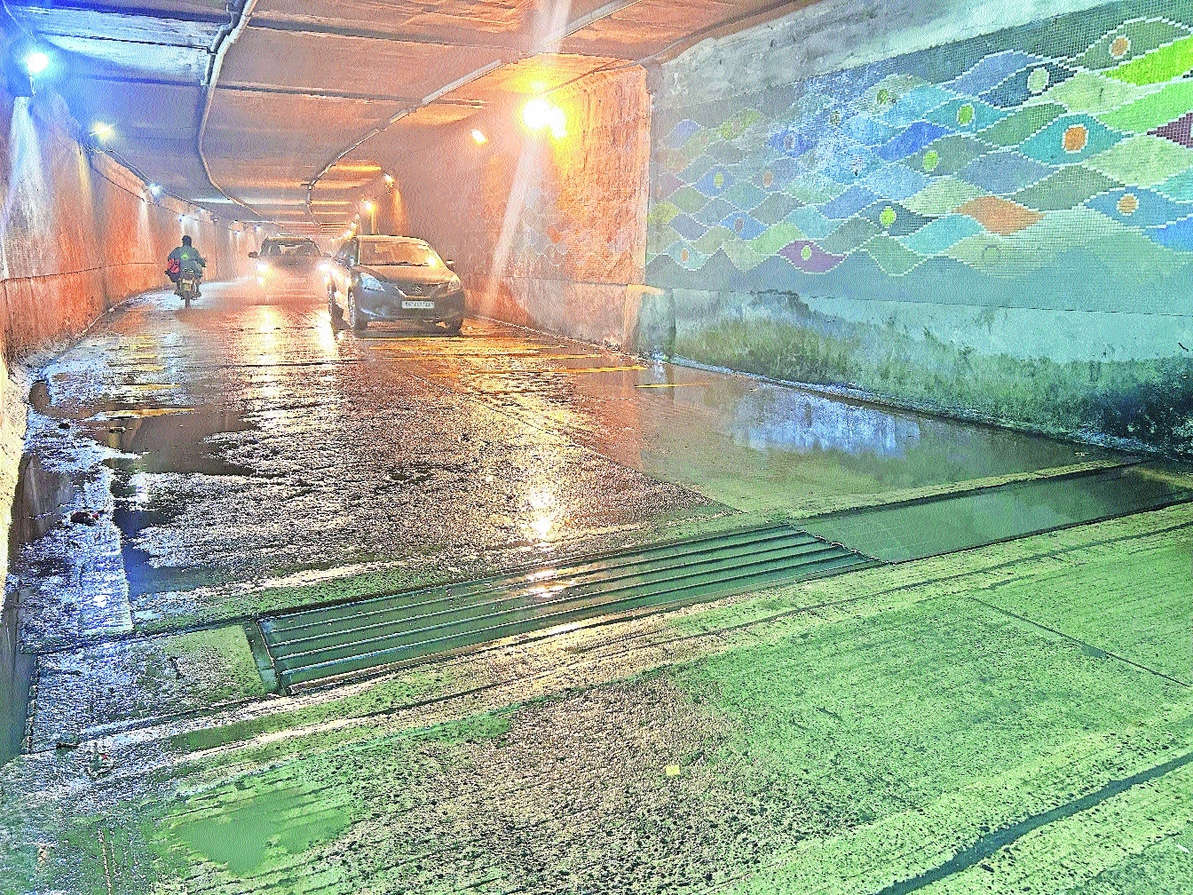 The water that has seeped through the sewer line onto the road