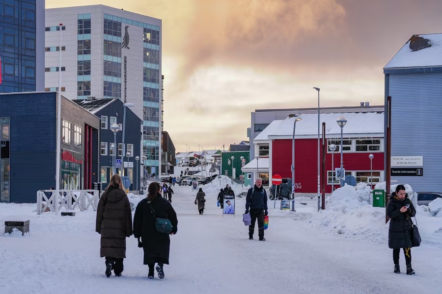 A person walks through a snow-covered street in Nuuk Greenland on Monday 