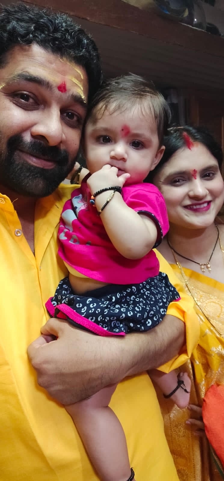 Krisha with her parents