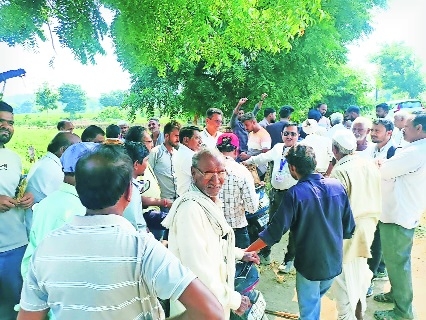 Villagers gathered around the officers and discussed issue