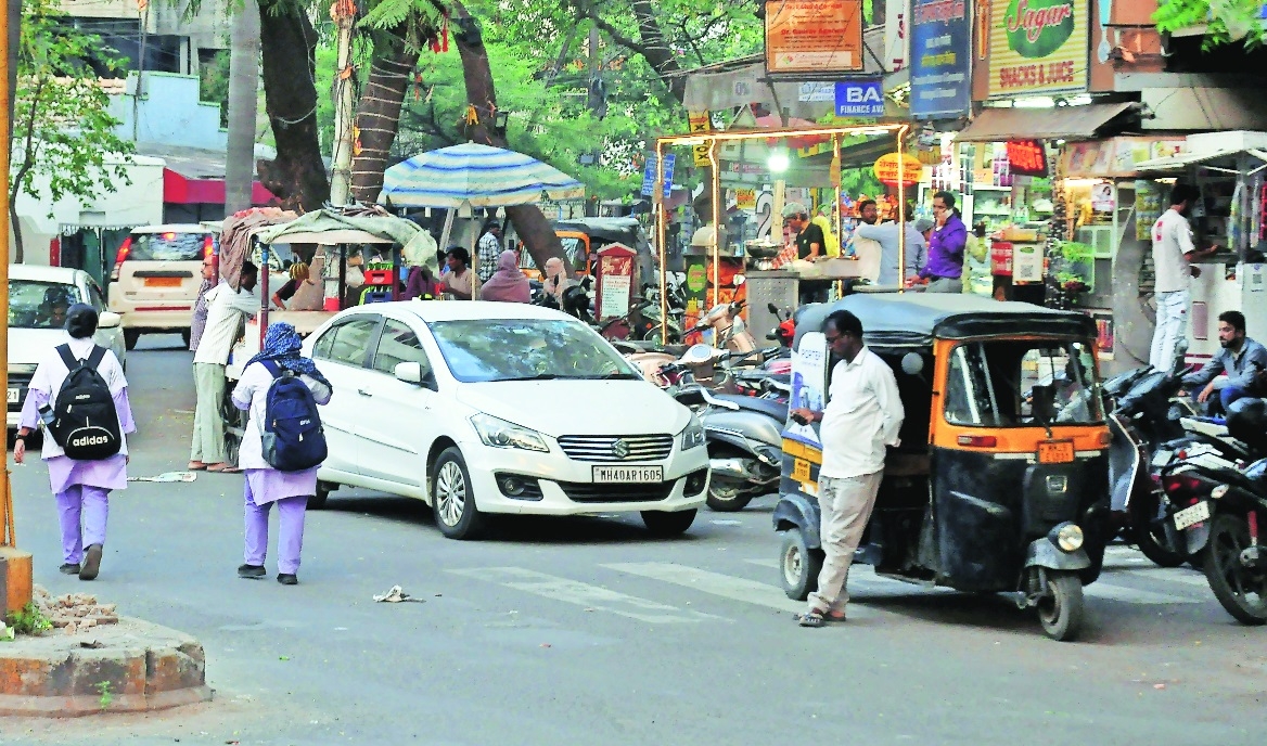 Encroachment on footpath along with illegal roadside parking 