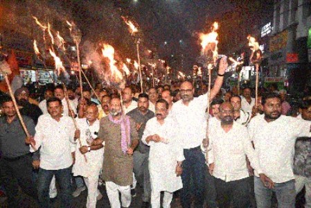 Congress members hold grand torchlight procession to protest NEET paper leak