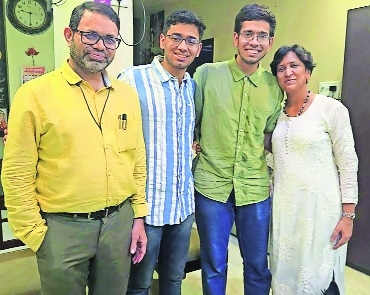 Aditya second left with from left father 