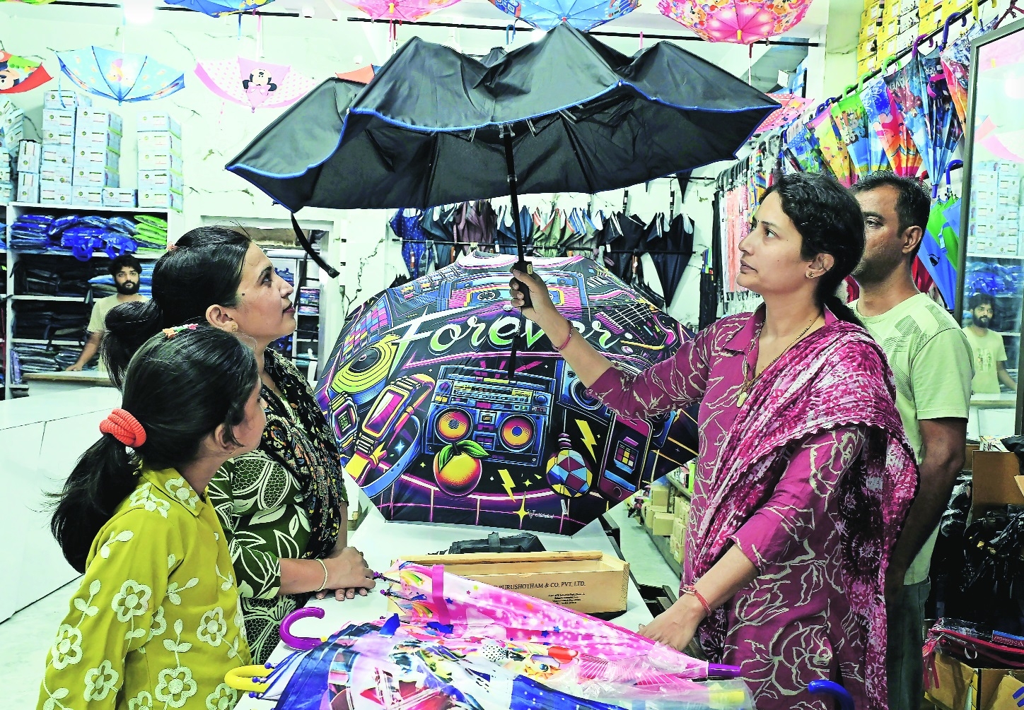 Monsoon shopping Smart electric umbrellas arrive in city markets