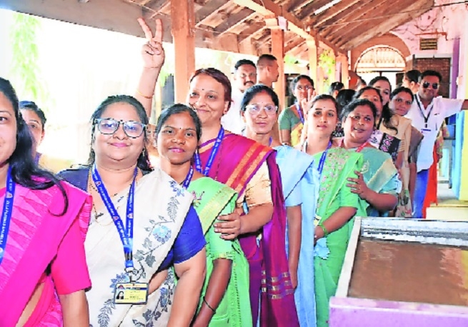 Voters queue up at a polling centre in Gondia