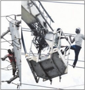 Sacked postal workerclimbs high-tensiontower over job dispute