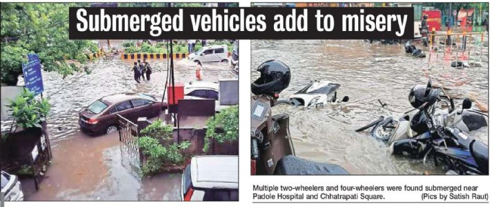 Torrential rains drench city Submerged vehicles add to misery