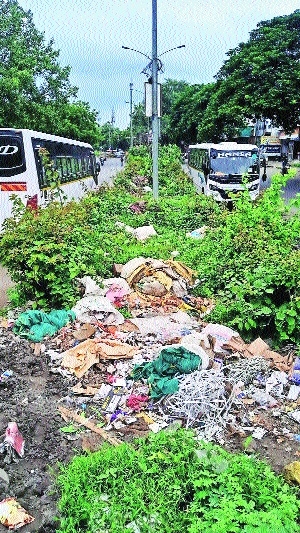 People turn divider on Ring Road near Mhalgi Nagar flyover into dumping site 