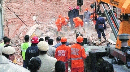Rescue personnel conduct a rescue operation on the second day after a 50-yea
